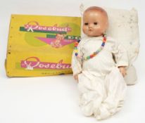 A Rosebud doll in original box:, mould hair and brown glass sleeping eyes,
