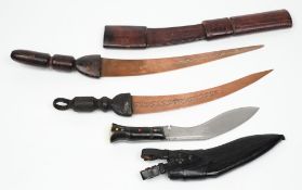 An African dagger:, the curved 33cm copper blade with stamped decoration,