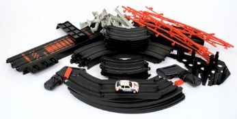 An Aurora racing set by Tomy:, unboxed, comprising track , transformer,
