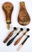 Two copper powder flasks:, one embossed with a hunting scene and devoid of nozzle,