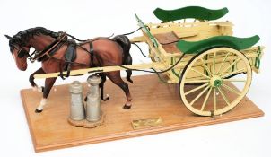 A Beswick model of a horse with a scale model 'Farm Dairy Float':, mounted on a wooden plinth,