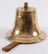 An all brass fire bell: with hammer and leather handle, 16cm. high.