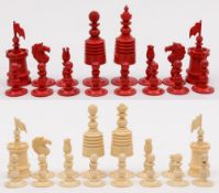 A 19th century ivory and stained chess set:, of ring turned form,