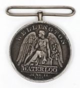 An 1815 Waterloo medal, indistinctly stamped 1st Batt. 27th Regt. Foot:, altered suspension..