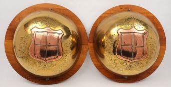A pair of copper and brass tompions from the King George V class battle ship HMS King George V:,