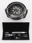 A gimbal mounted liquid filled compass:, 15cm diameter, by Heath Marine, London,
