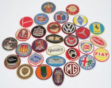 A collection of mid-20th car manufacturer's logos on pressed tinplate badges:,