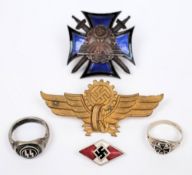 A Third Reich period National Socialist Party enamel badge, together with two rings,