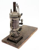 A Bing spirit fired vertical live steam engine:, the plated boiler with 4  1/4 inch flywheel,