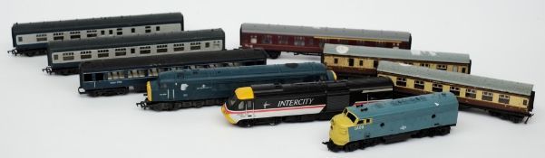Three Diesel locomotives and six carriages:, various liveries, unboxed.
