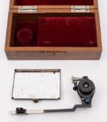 A cartographer's eye glass:, in velvet lined fitted mahogany case.