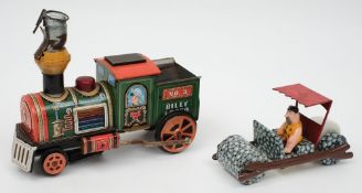 A Louis Marx tin plate Fred Flintstone 'Flivver' friction drive stoneage car and a Japanese tin