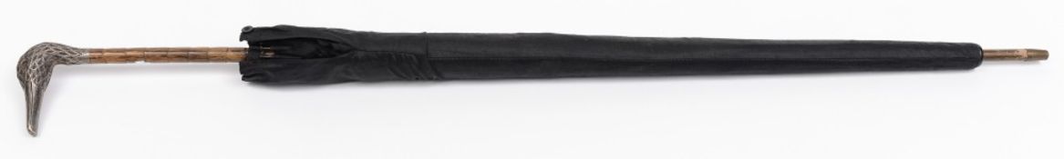 A George V silver duck's head handled umbrella, maker W & G, London 1910:,