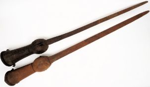 An Indian Pata: with shaped gauntlet and 93cm. blade, together with an near matching Pata. (2).