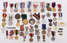 A collection of various military and civilian medals,