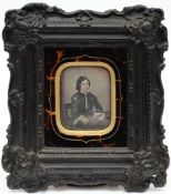 A 19th century hand tinted daguerrotype of a young girl:,