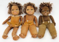 Three Norah Wellings black dolls:, each with glass eyes and painted faces over cloth body,