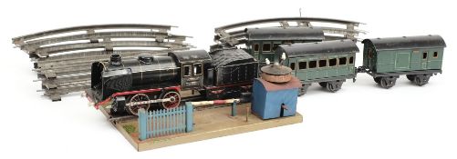 A Marklin 0-4-0 locomotive and tender 'R890', together with three carriages,