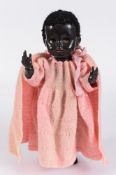 A Pedigree black plastic doll: with curly hair, weighted brown eyes,