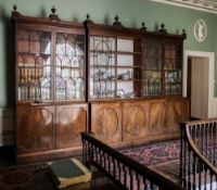 An impressive George III mahogany breakfront library bookcase of large size:,