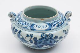 A late 17th century English dated delftware spice jar: of squat globular form with scroll handles,