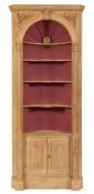A carved pine barrel back standing corner cupboard:,