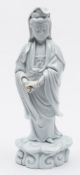 A Chinese blanc de Chine figure of Guyanyin: modelled barefoot and wearing a beaded necklace and
