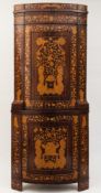 An early 19th Century Dutch mahogany and floral marquetry bow fronted standing corner cupboard:,