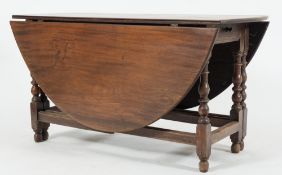 An unusual mid 18th Century mahogany oval gateleg table:,