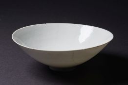 A Chinese blanc de Chine porcelain bowl: of finely potted circular form with notched rim and hidden