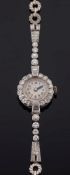 A lady's 18ct white gold and diamond cocktail wristwatch:,