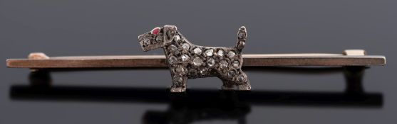 An early 20th century gold, silver and rose-diamond set 'terrier' bar brooch:.