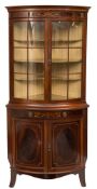 An Edwardian mahogany and inlaid bow-fronted standing corner display cabinet:,