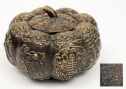 A late 19th century Chinese brass bowl and cover:, of gourd shaped outline,