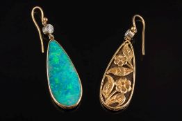 A pair of black opal and diamond pendant earrings: each with a pear-shaped black opal approximately