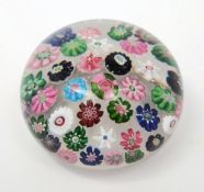 A Clichy spaced millefiori paperweight: with central cabbage cane,