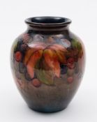 A Moorcroft pottery flambé vase: of oviform tubelined in the Leaf and Fruit pattern in red, orange,