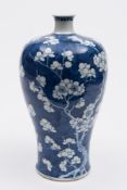 A Chinese blue and white meiping vase: painted overall with prunus on a cracked ice ground,