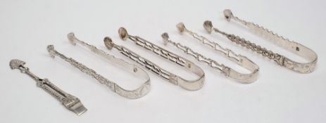 A pair of Georgian silver sugar tongs, maker GB: initialled with pierced decoration,