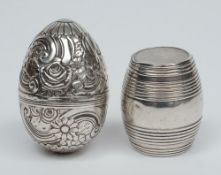 A Continental white metal nutmeg grater:, initialed M.F of egg-shaped embossed design, 4.