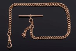 A 9ct gold curb-link watch chain: with graduated links with attached T-bar,