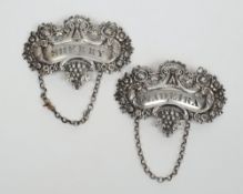 Two 19th century silver wine labels, marks illegible:, 'Madeira' and 'Sherry', 8 cm wide,