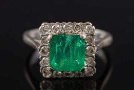 An 18ct white gold, emerald and diamond square cluster ring:,