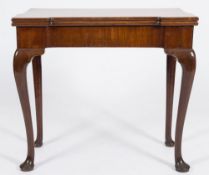 A mid 18th Century mahogany tea table:, the plain hinged top with projecting corners,