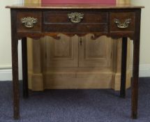 An 18th Century oak side table:, fitted with three drawers.