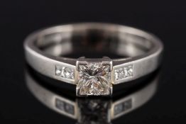 A platinum and princess-cut diamond single-stone ring:, the princess-cut stone approximately 0.