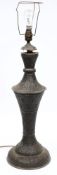 A late 19th century Indian filigree metal lamp:, of double waisted outline,