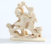 A Japanese carved ivory okimono: in the form of a shouting man fending off four monkeys from his