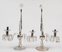 A pair of Regency-style cut glass two-branch lustre candelabra: of faceted design,