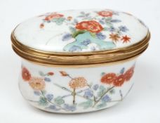 A Meissen gold mounted snuff box: of oval cartouche form,